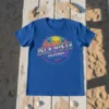 Isla Vista California text with retro sunset and palm trees graphic on a blue t-shirt
