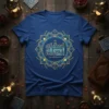 Blue t-shirt with circular Arabic calligraphy design in gold and blue, featuring "إستلام العوام محمد صيم السنت عدم" quote