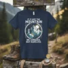 T-shirt with the quote "IT IS NOT THE MOUNTAIN WE CONQUER, BUT OURSLVES" above and below a circular mountain landscape