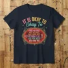 T-shirt with colorful text "IT IS OKAY TO Okay To MAKE MISTAKES NOT BE OKAY HAVE HARD DAYS NOT KNOW