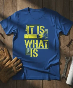 Blue t-shirt with yellow distressed text reading "IT IS WHAT IS" in bold block letters