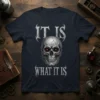 It Is What It Is t-shirt design featuring a cracked skull with red glowing eyes and gothic lettering
