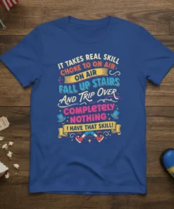 It Takes Real Skill quote t-shirt design with colorful typography detailing humorous mishaps like falling up stairs and tripping over