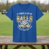 It Takes A Lot Of Balls To Golf The Way I Do quote on a blue t-shirt with a graphic