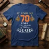 It Took Me 70 Years To Look This Good t-shirt design with bold orange 70 and thumbs-up graphics