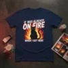 Black cat sitting in flames with text "It Was Already On Fire When I Got Here" on a navy t-shirt