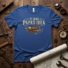 Blue t-shirt with "It Was Papa's Idea" text and a steampunk airplane graphic