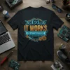 Black t-shirt with "IT WORKS ON MY MACHINE STNE OH ATEN MIT RARCHINE ON MY MACHINE" text in gold and