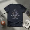 It's All About You Holistic Studio design with a meditating figure and lotus flower on a navy t-shirt