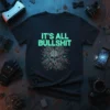 Black t-shirt with "IT'S ALL BULLSHIT" in neon green text above a detailed tech skull and circuit board graphic
