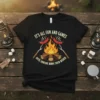 Black t-shirt with "It's All Fun and Games Until Someone Burns Their Weiner" quote and graphic of sausages cooking over