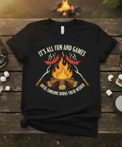Black t-shirt with "It's All Fun and Games Until Someone Burns Their Weiner" quote and graphic of sausages cooking over