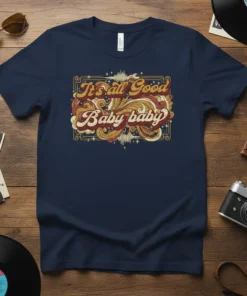 Retro "It's all Good Baby baby" quote t-shirt with vintage wavy typography and ornate border