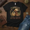 It's Alright To Be Little Bitty cowboy t-shirt with guitar, boots, and hat design