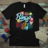 It's Bingo Night text with colorful bingo balls and cards graphic on a black t-shirt