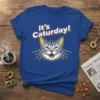 It's Caturday! quote with a smiling cat face graphic on a blue t-shirt