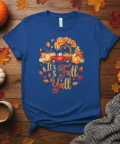 It's Fall Y'all text with red truck, pumpkins, and autumn tree graphic on a blue t-shirt