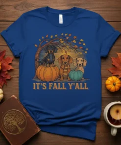 It's Fall Y'all text with three dachshunds sitting on pumpkins under a fall tree graphic