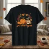 It's Fall Y'all t-shirt design with pumpkins, a coffee mug, and autumn leaves surrounding the text