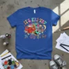 It's Fri-yay! Tt Gg Ii Ff text with cartoon book and pencil characters on a royal blue t-shirt