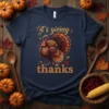 Navy blue t-shirt with "it's giving thanks" text and a detailed illustration of a turkey for Thanksgiving