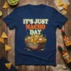 It's Just Nacho Day text with a bowl of loaded nachos graphic on a navy blue t-shirt
