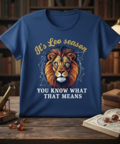 Blue t-shirt with "It's Leo season YOU KNOW WHAT THAT MEANS" text and a stylized lion head graphic with geometric