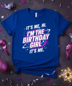 Blue t-shirt with bold white, pink, and blue text that reads "IT'S ME, HI. I'M THE BIRTHDAY GIRL IT'S ME."