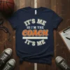 It's Me Hi I'm The Coach It's Me text design on a navy t-shirt, featuring bold orange and cream lettering
