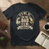 T-shirt with "It's Me, Hi I'm The Dad It's Me. Ultimate Dad Mode Activated" text, muscle arm, baby bottle, and