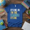 IT'S ME, HI. I'M THE TEACHER. IT'S ME. quote on a royal blue t-shirt, designed for teachers