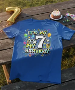 It's My 7th Birthday T-Shirt with colorful text "IT'S MY 7TH IT'S MY BIRTHDAY" and festive graphics
