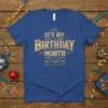 Blue t-shirt with gold text that reads "IT'S MY BIRTHDAY MONTH YES. I GET THE WHOLE MONTH"