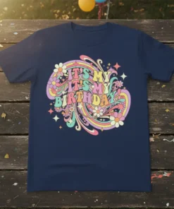 Retro groovy birthday t-shirt design with colorful text "IT'S MY IT'S MY BIRTHDAY" and floral accents