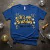 It's my Birthday SIGN MY SHIRT text on a royal blue t-shirt with gold glitter, balloons, and confetti graphics