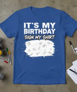 Blue t-shirt with white text "IT'S MY BIRTHDAY SIGN MY SHIRT" and a white paint splatter graphic filled with signatures
