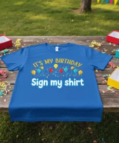 Blue t-shirt with "IT'S MY BIRTHDAY Sign my shirt" text and colorful balloons and lights graphic