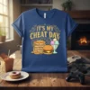 It's My Cheat Day t-shirt design with stacked pancakes, burger, and ice cream sundae graphic