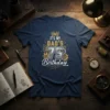 IT'S MY DAD'S 75 BIRTHDAY text design with crown and gears graphic on a navy blue t-shirt