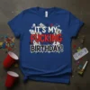 It's My Fucking Birthday! bold typography with dripping red letters and distressed newspaper background on a blue t-shirt