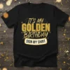 Black t-shirt with "It's My Golden Birthday Sign My Shirt" in gold glitter text, perfect for birthday celebrations