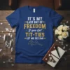 Blue t-shirt with bold gold and white text: "IT'S MY LAST DAY OF FREEDOM If you Got TIT-TIES LET ME