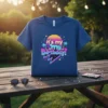 Retro 80s style t-shirt with neon text "it's my my Birthday!" featuring a sunset, palm trees, and lightning bolts