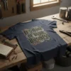 Dark blue t-shirt with bold text "It's None Of Your Business" surrounded by intricate gears and steampunk-inspired design elements