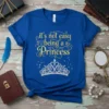 Royal blue t-shirt with gold text "it's not easy being a Princess" and a sparkling diamond crown graphic
