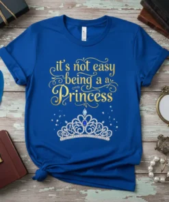 Royal blue t-shirt with gold text "it's not easy being a Princess" and a sparkling diamond crown graphic