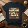 It's Not Hoarding If It's Books quote on a t-shirt, featuring a bookshelf filled with colorful books