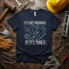 T-shirt with the quote "IT'S NOT HOARDING IF IT'S TOOLS" and line art of various tools like wrenches, saw, and