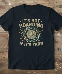 It's Not Hoarding If It's Yarn quote on a dark t-shirt with a yarn ball and knitting needles graphic