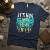 IT'S NOT NOT THAT DEEP quote with stylized ocean waves and small fish on a navy t-shirt